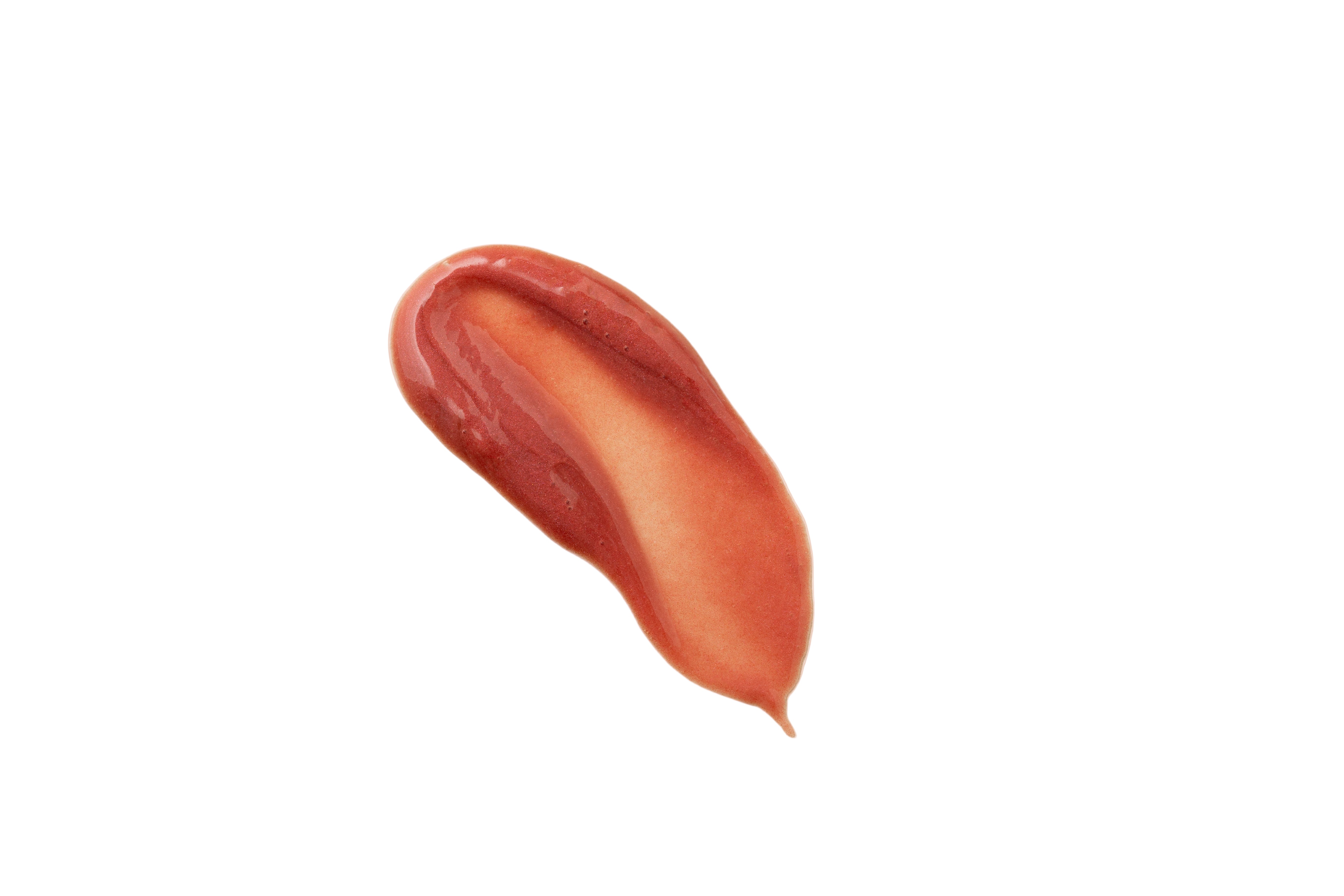 Lip balm smear on a beige background